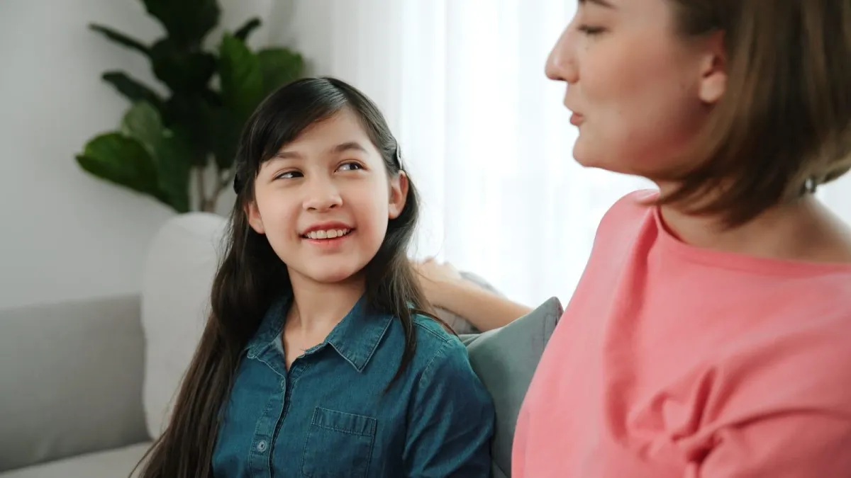 mother talking to her daughter