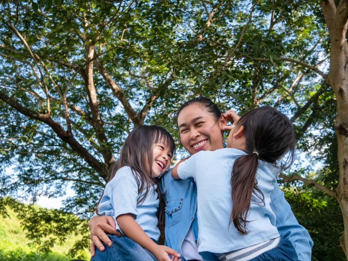 mom laughing with her daughters