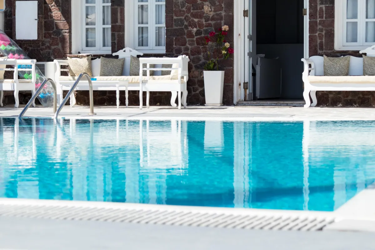 close up of pool off the back of a house