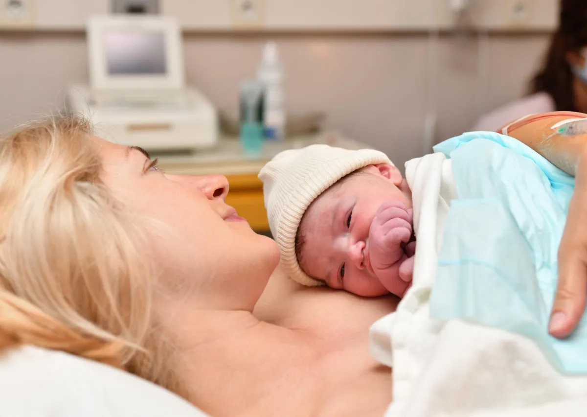 woman with newborn on her chest