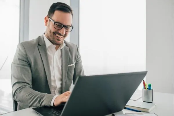 Smiling Digital Investigator with Laptop