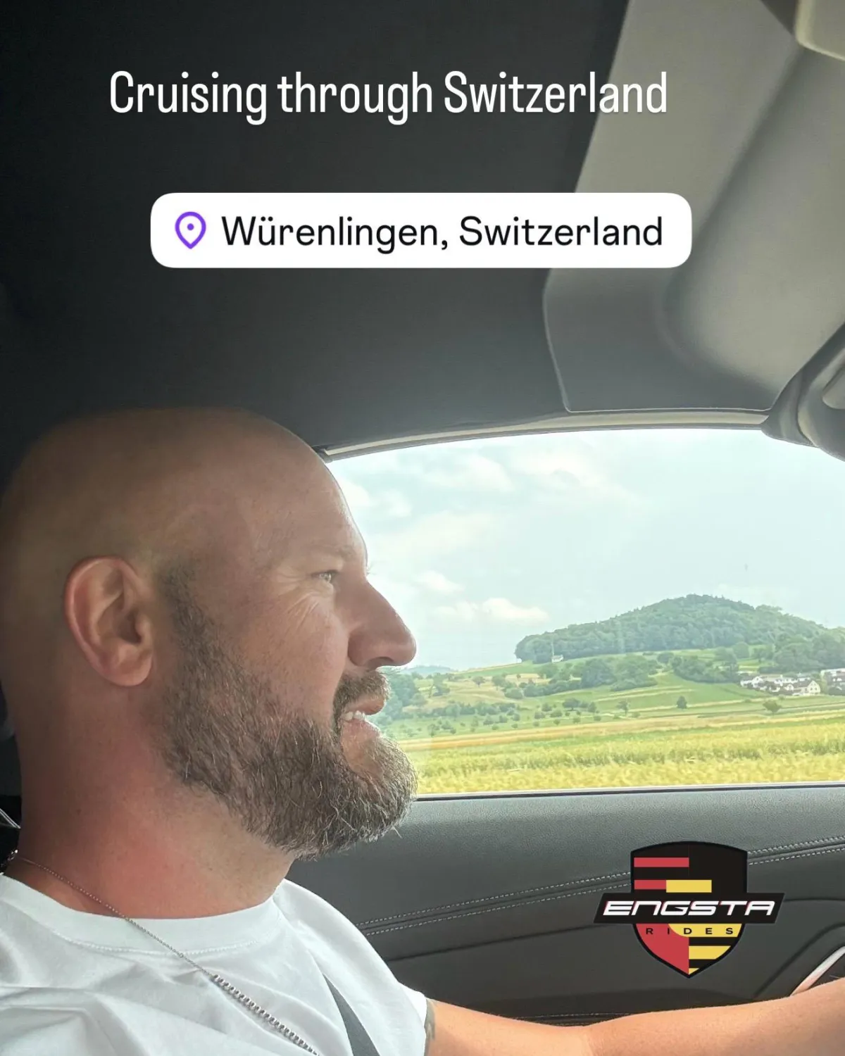 bald man driving car