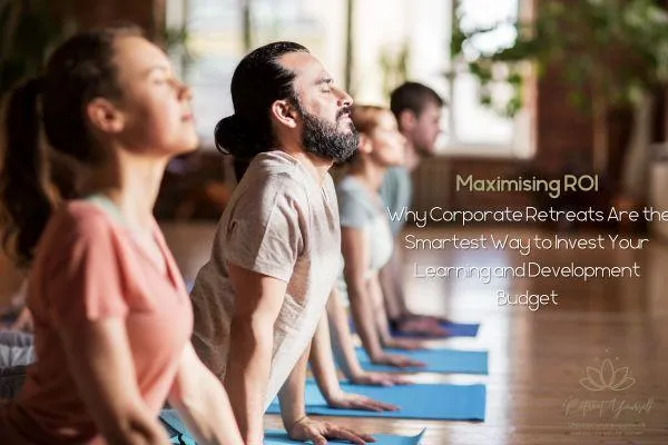 Work colleagues doing yoga at a corporate retreat