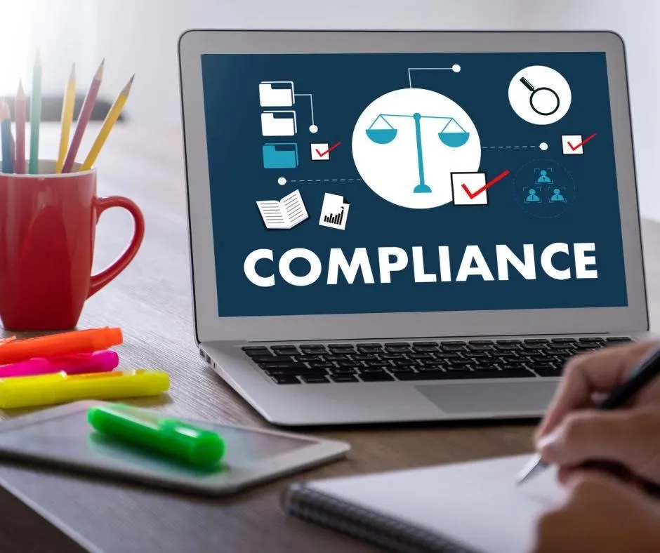 A computer screen with the word compliance written on it