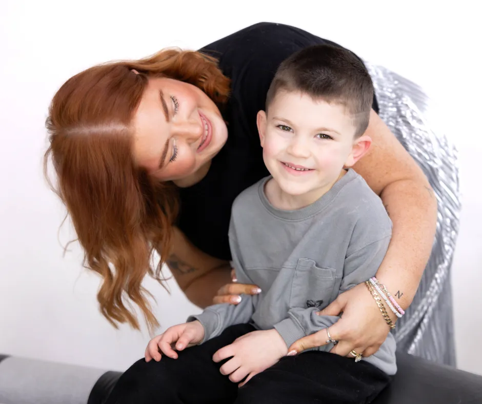 Dr. Danielle hugging pediatric patient