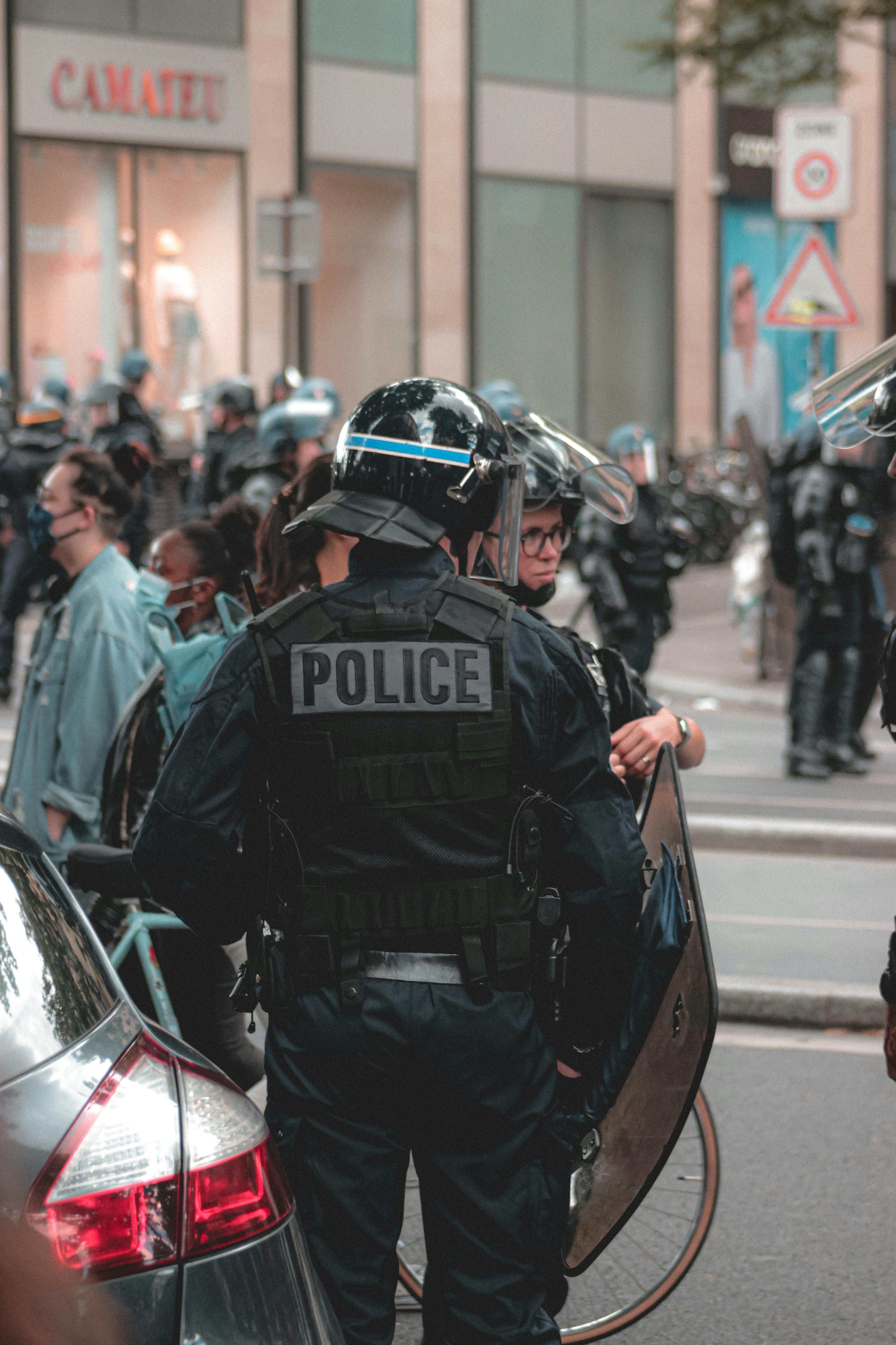 officer in full tactical gear working in the street during the day