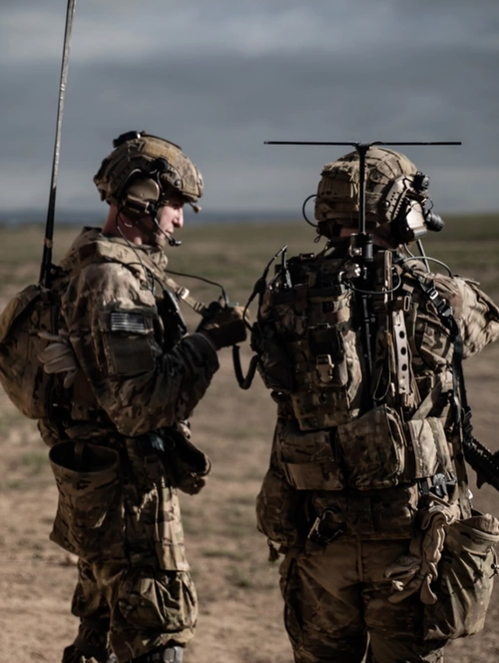 soldiers in the field using equipment
