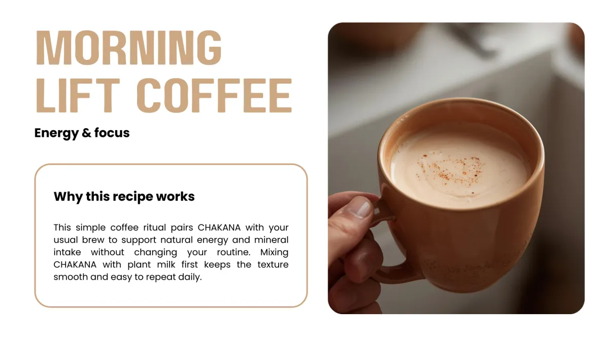 Hand holding a warm cup of coffee with creamy foam