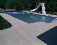 An inground pool with steps