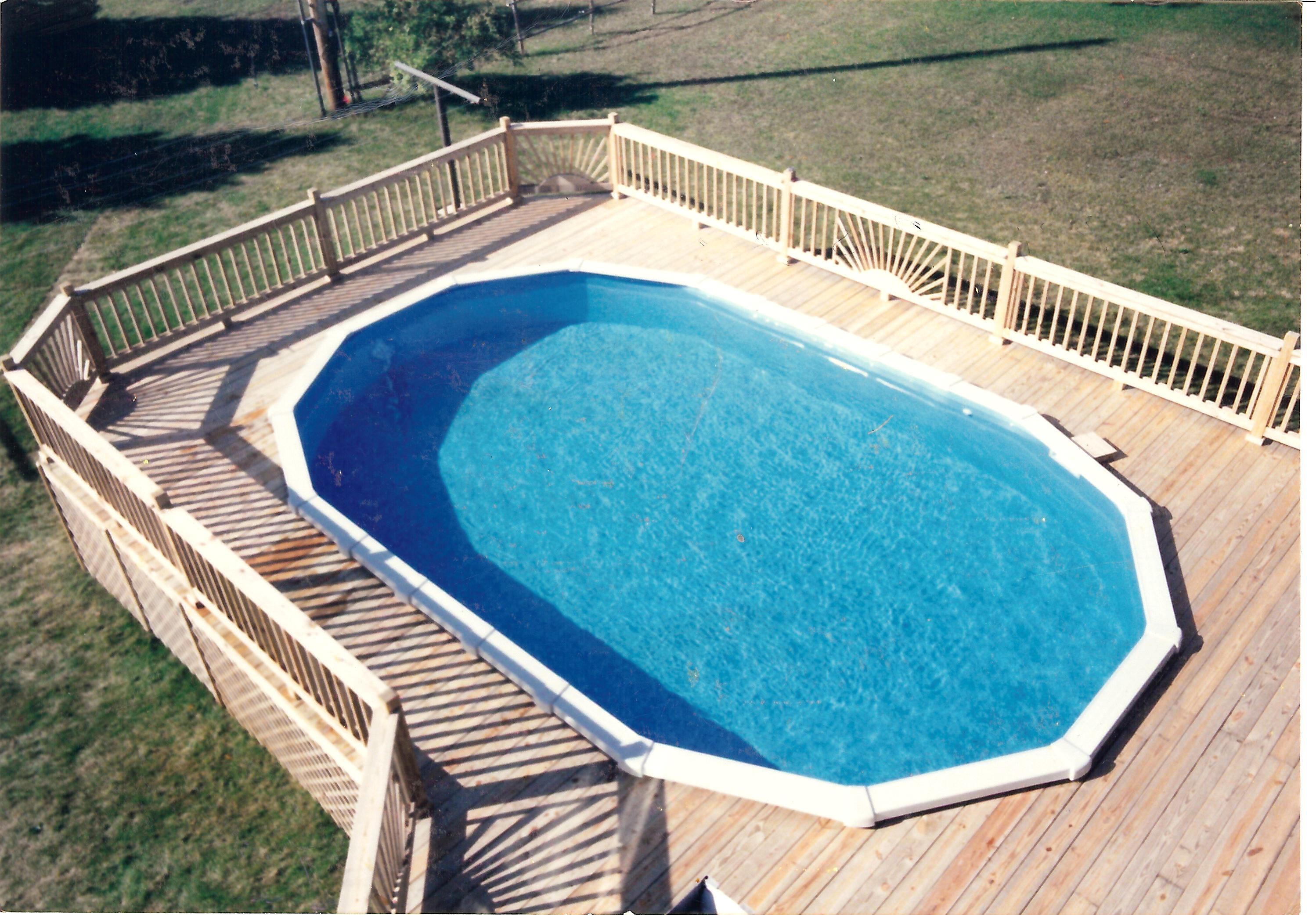 A fenced-in inground pool