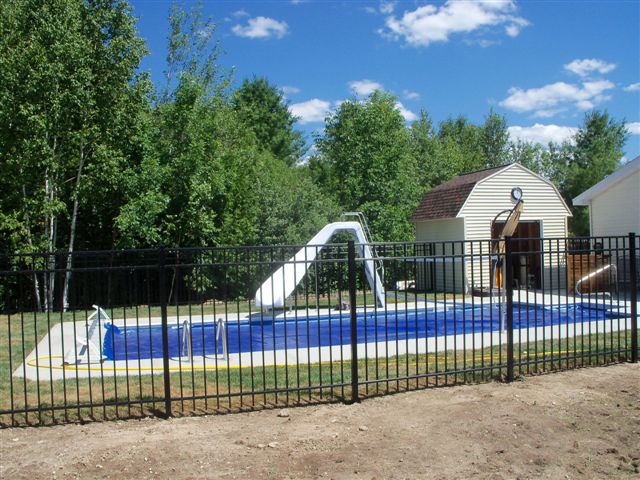 Another angle of the covered inground pool with a slide