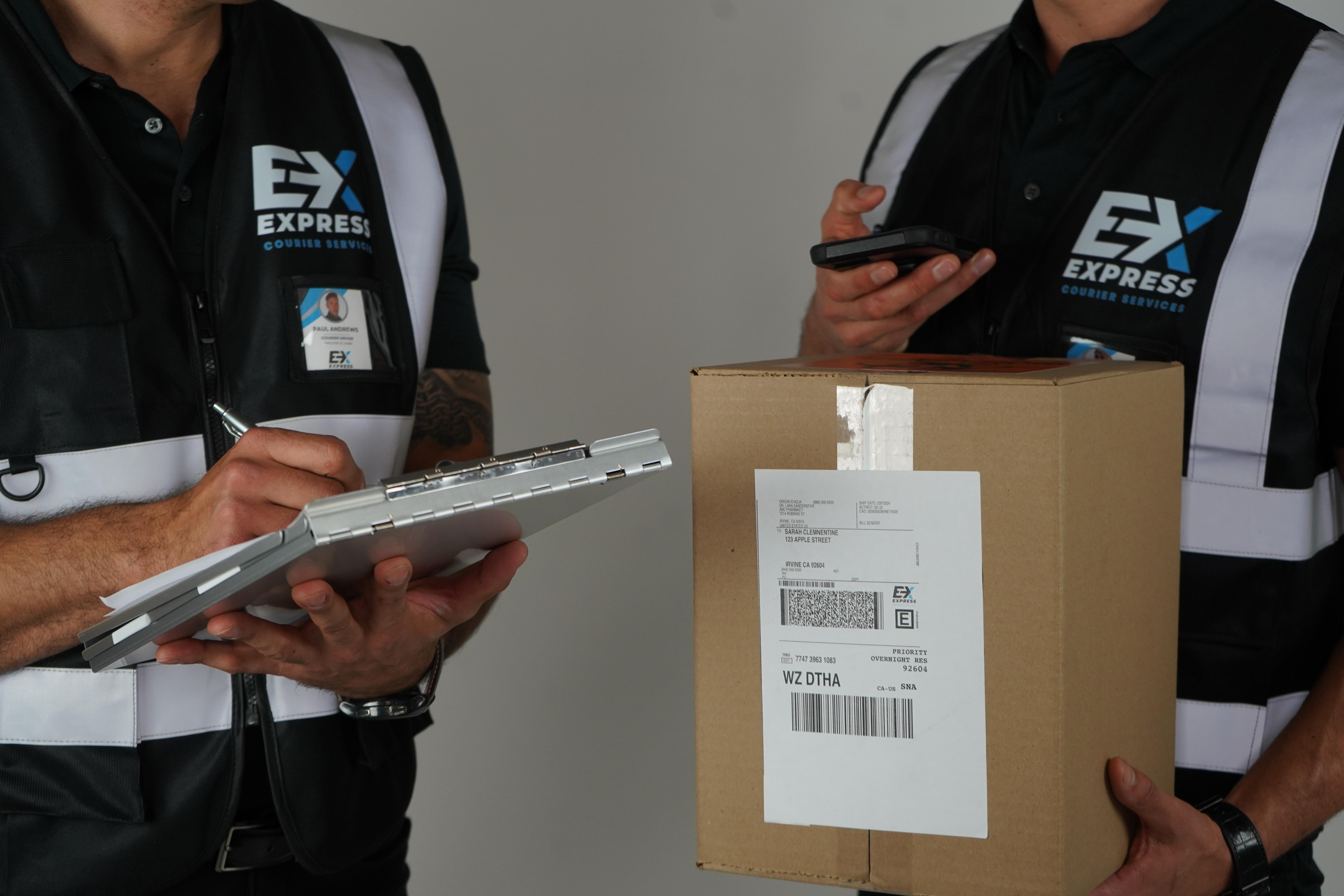 Courier service staff scanning a package and recording proof of delivery using mobile real-time tracking technology for secure and reliable shipments.