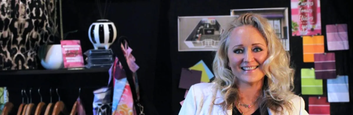 Women at Curves in Front of Amaze Yourself Sign