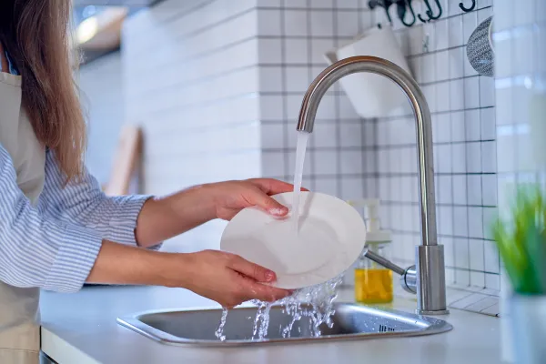 Image of a person practicing mindfulness in everyday activities, such as eating, walking, or washing dishes.