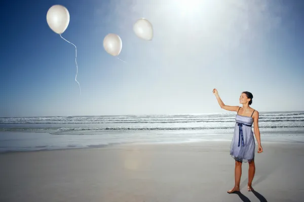 Image of a person letting go of a balloon or a symbolic representation of forgiveness.