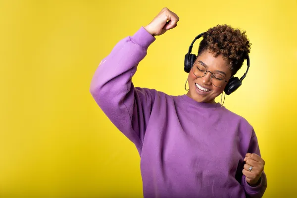 Image of a person listening to relaxing music or playing a musical instrument.