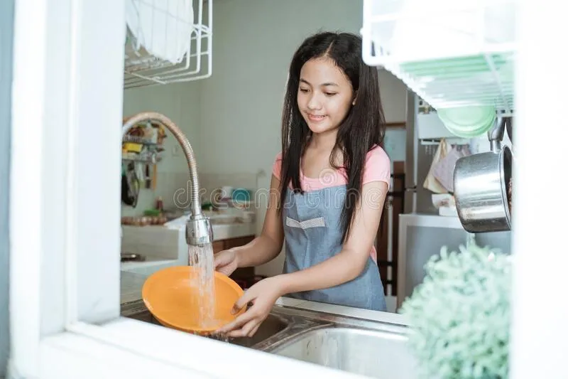Girl washing dishes