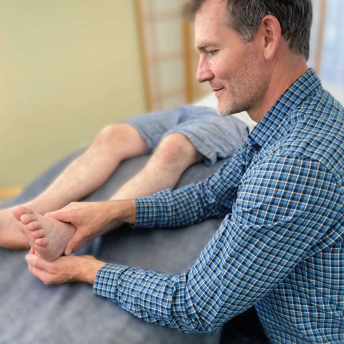 Jared doing manual therapy on an ankle
