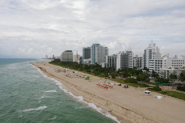 Aerial view of Miami Beach, oceanfront condos, and shoreline for people moving to Florida