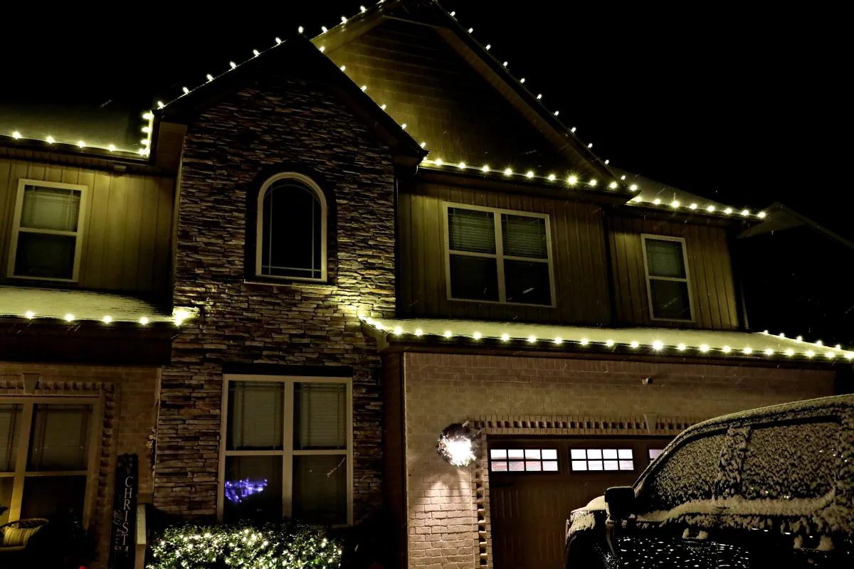 A set of white LED Christmas lights in Clarksville TN on a snowy evening