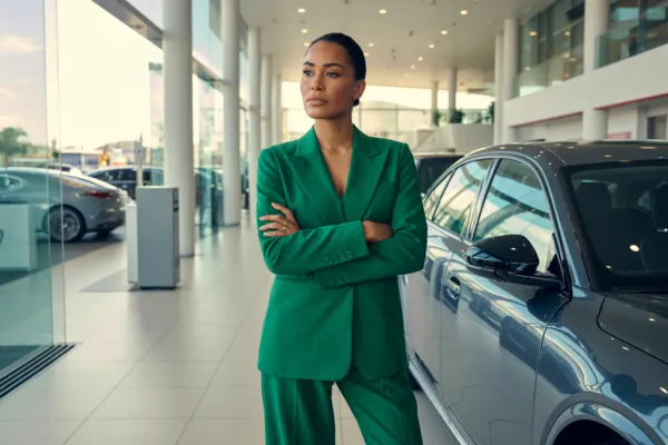 Woman in bold outfit in dealership