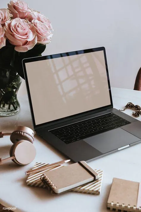 Minimalist workspace with flower and laptop symbolizing balance in business