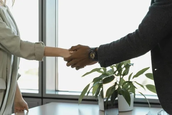 , symbolizing partnership, hiring, recruiting, employment, and candidates.