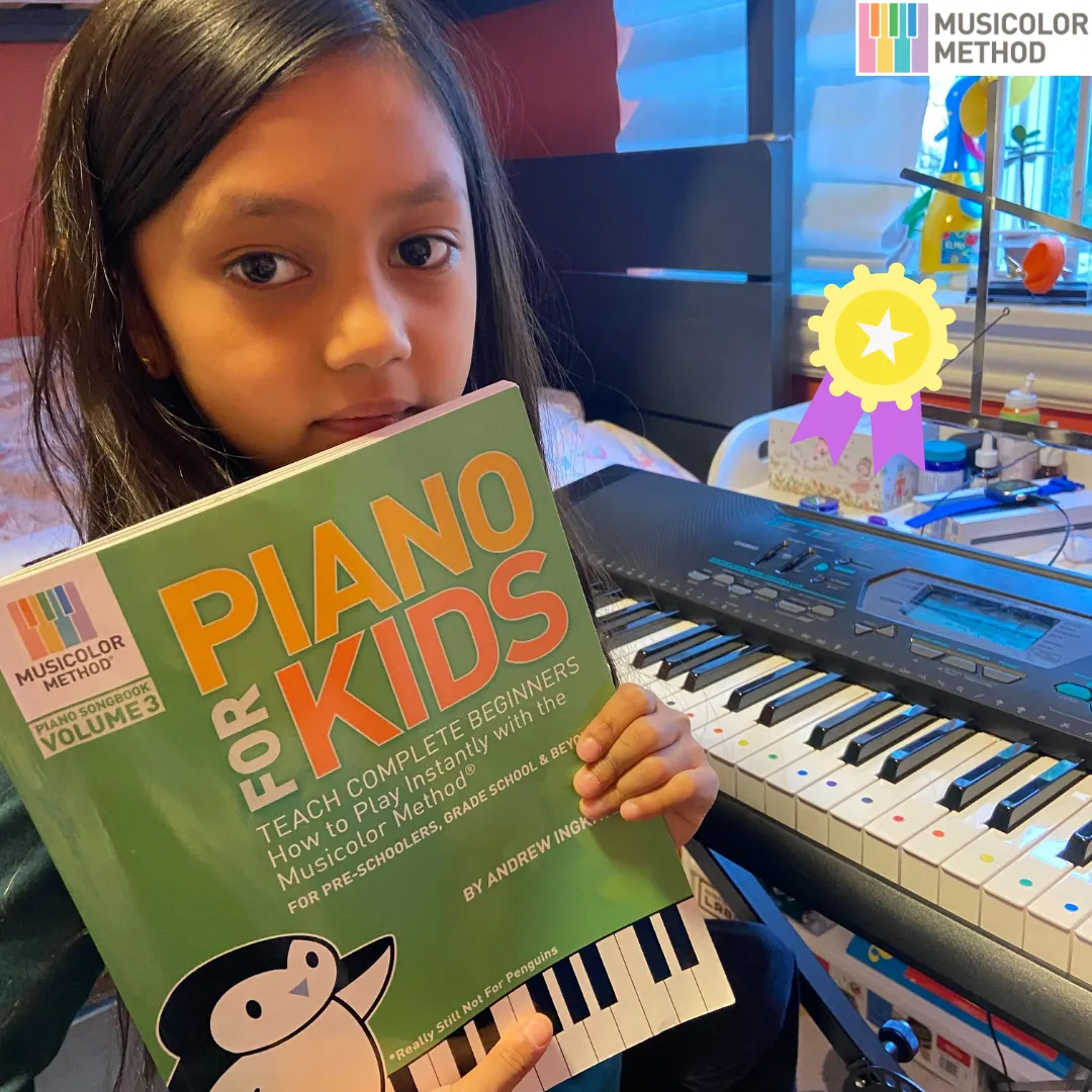 Child playing piano at Musicolor Method Park Slope, learning through organized music lessons.