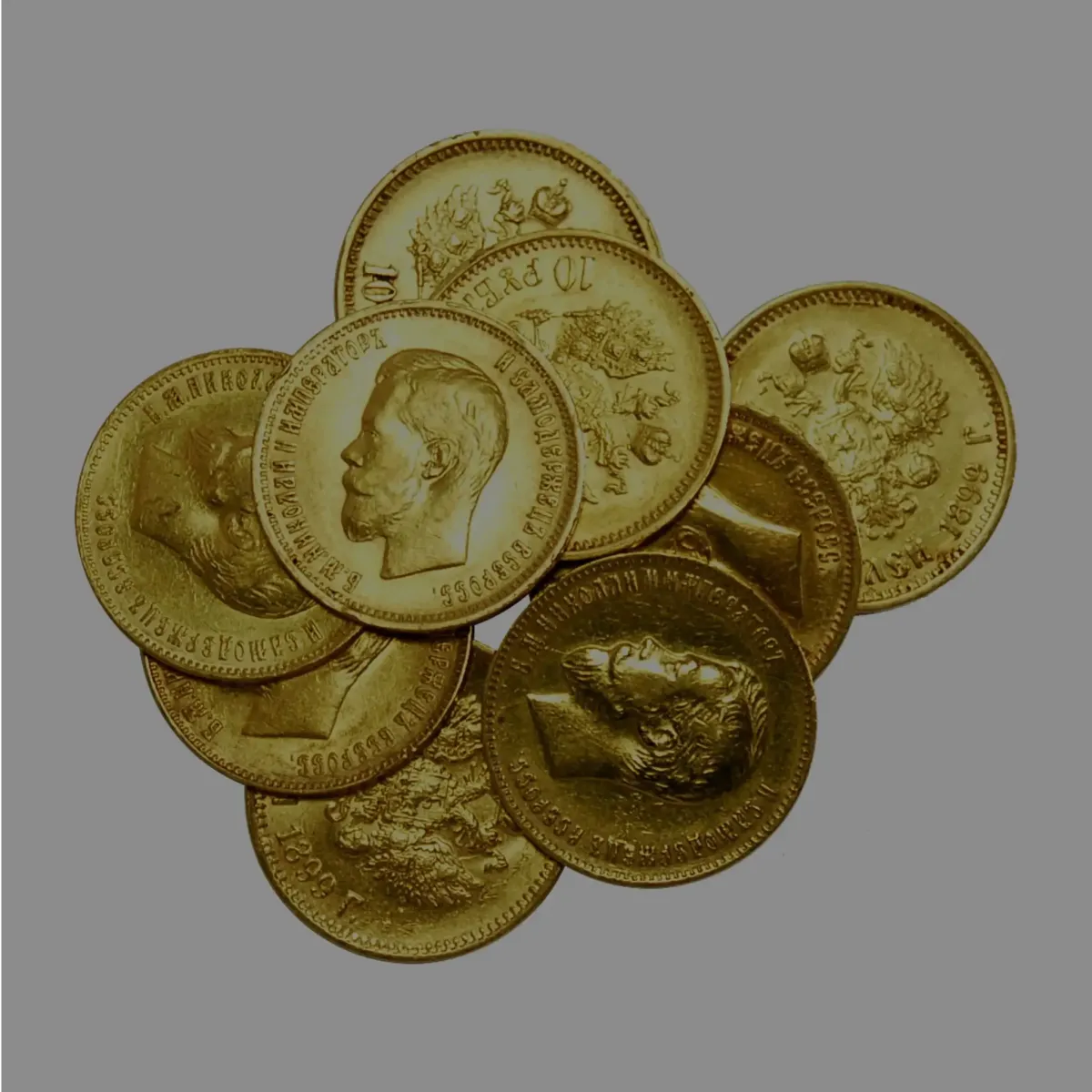 Scattered gold sovereign coins and rare gold currency available for collectors.