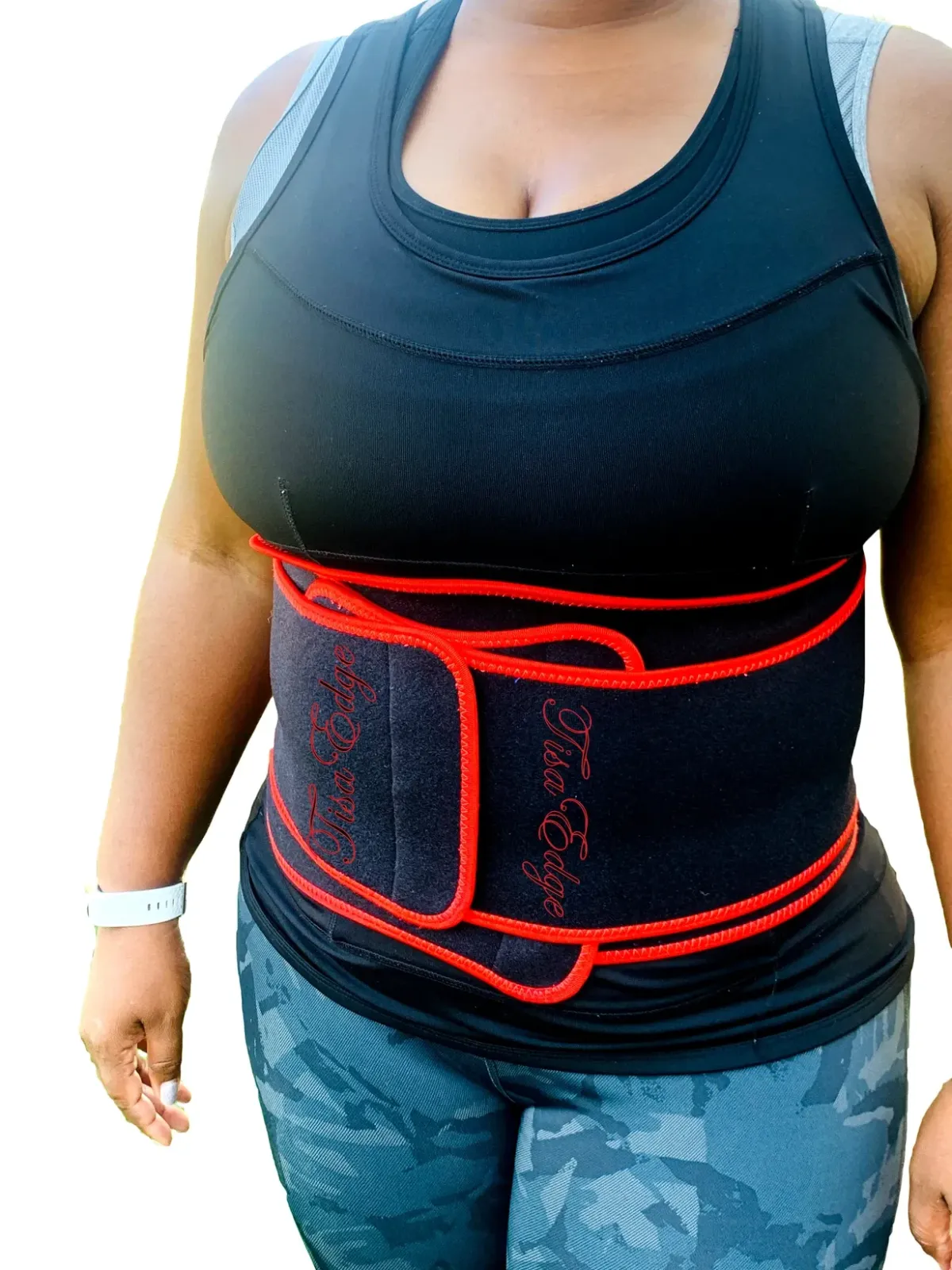 Tisa Edge wearing a sweat belt during a workout, representing fitness, wellness, and self-care commitment.
