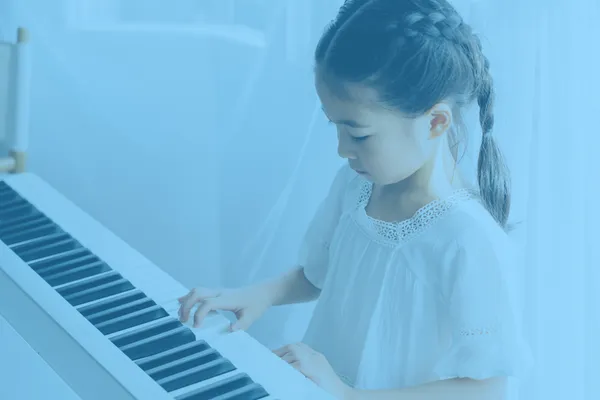 Kid playing piano