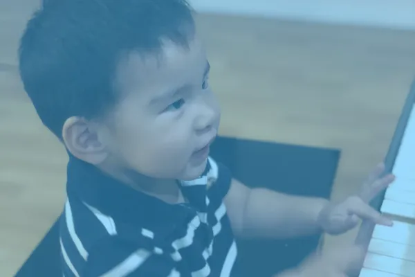 Kid playing piano