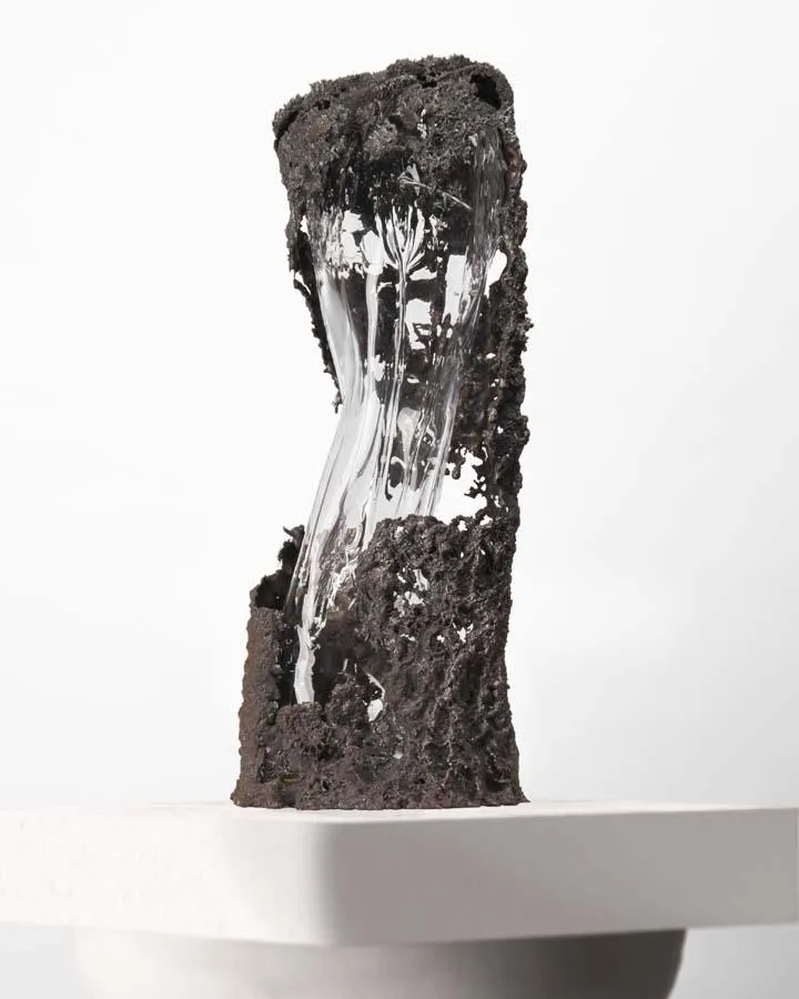 delicate cast iron with a clear blown glass structure