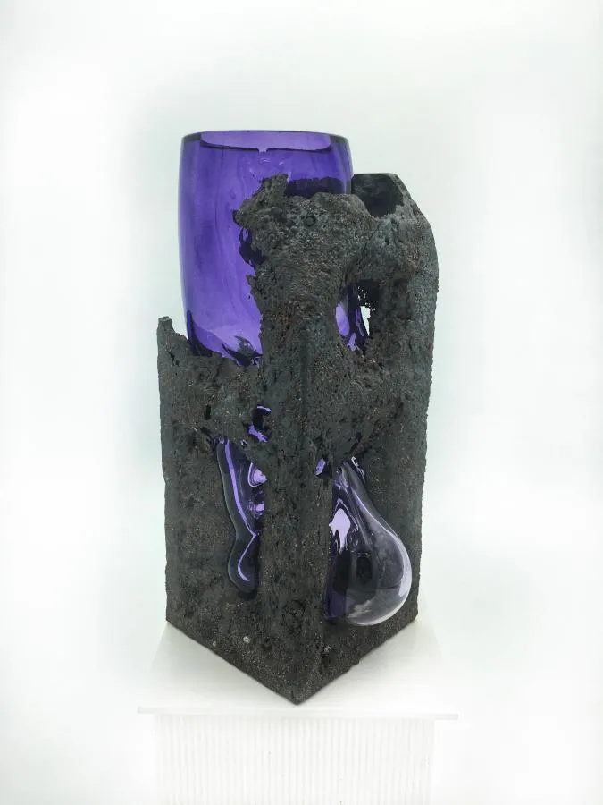 cast iron with purple glass blown into it
