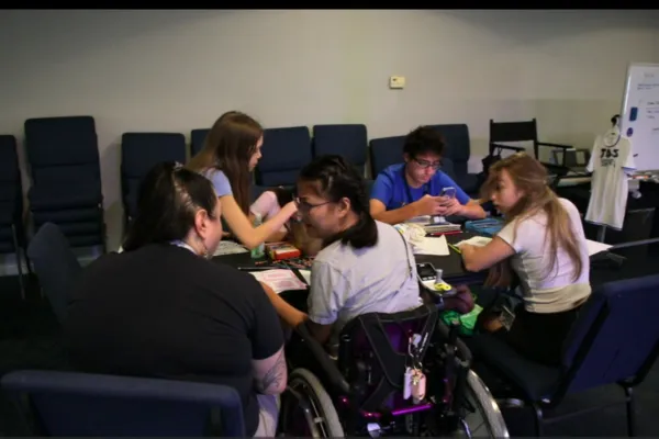 Students and instructors working together backstage at JDS Creative Academy
