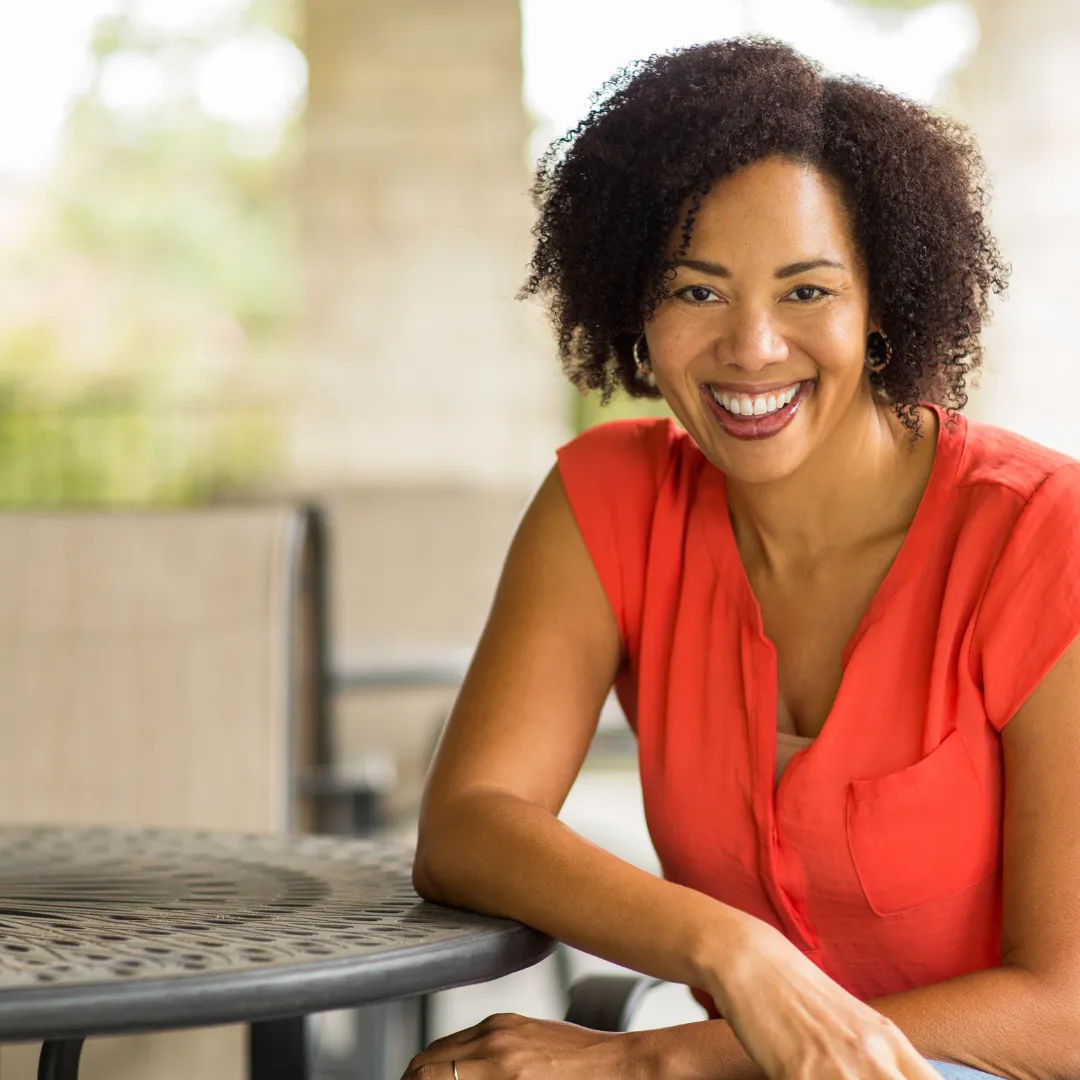 confident woman sitting in front of her laptop