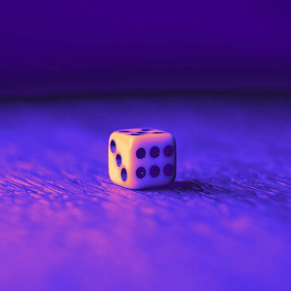 Dice symbolising placing small bets and winning big