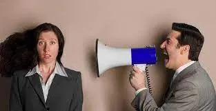 a girl, megaphone and guy shouting