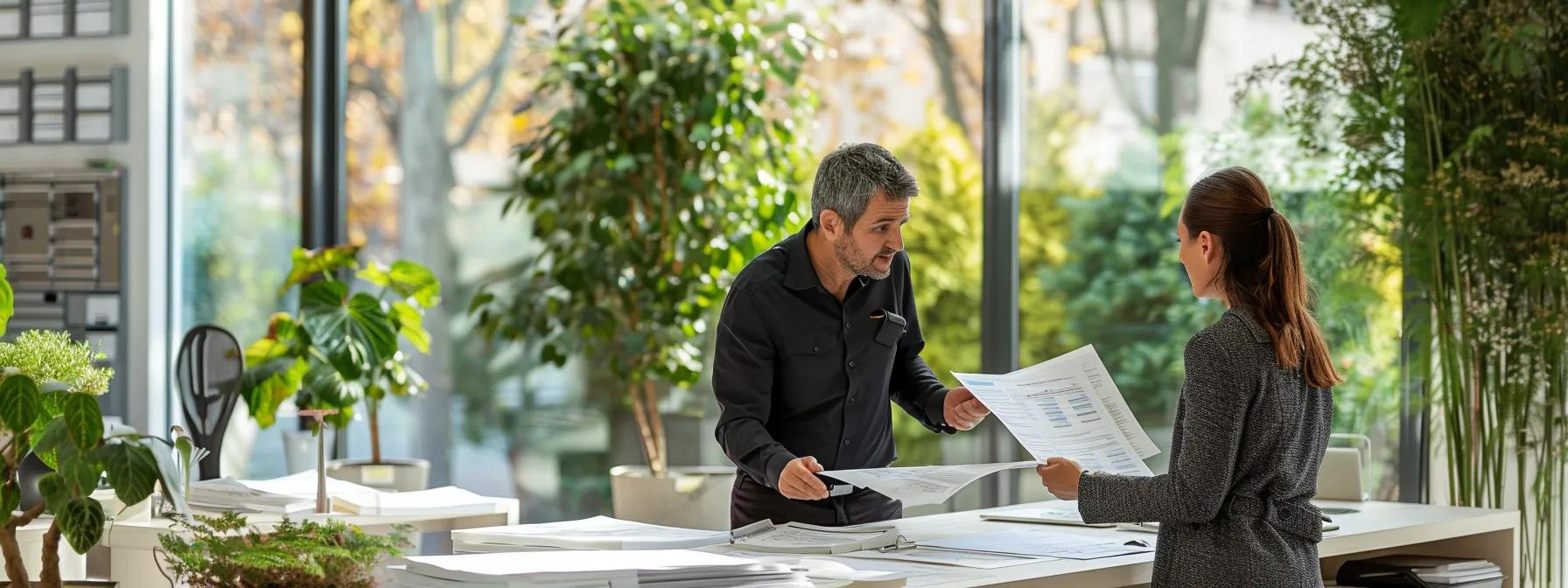 Image of professional tree service contractors looking over papers