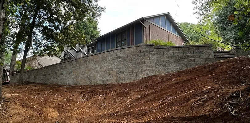 Solving Slopes and Erosion in Knoxville Yards: When to Consider Retaining Walls and Grading