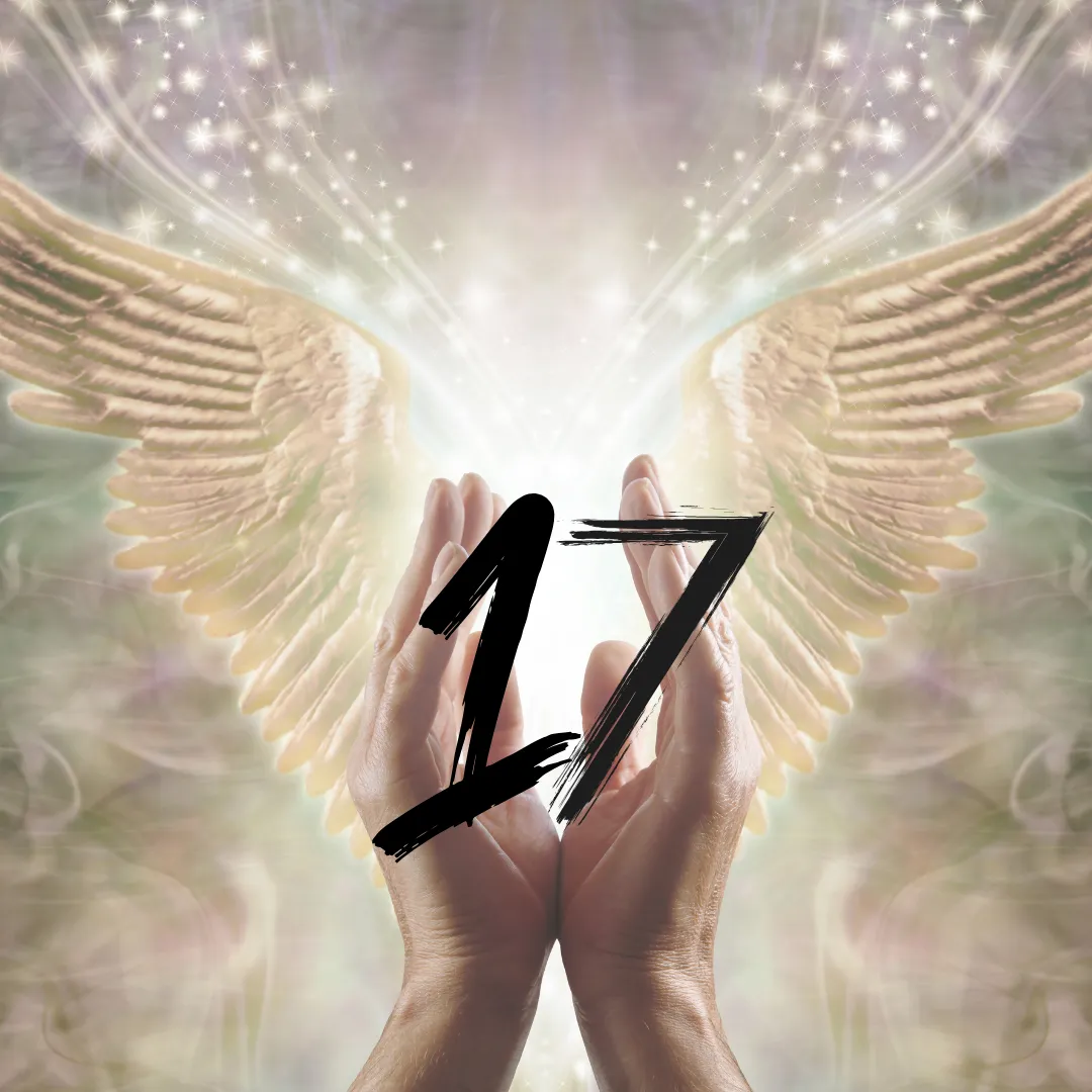 angel hands holding the number seventeen