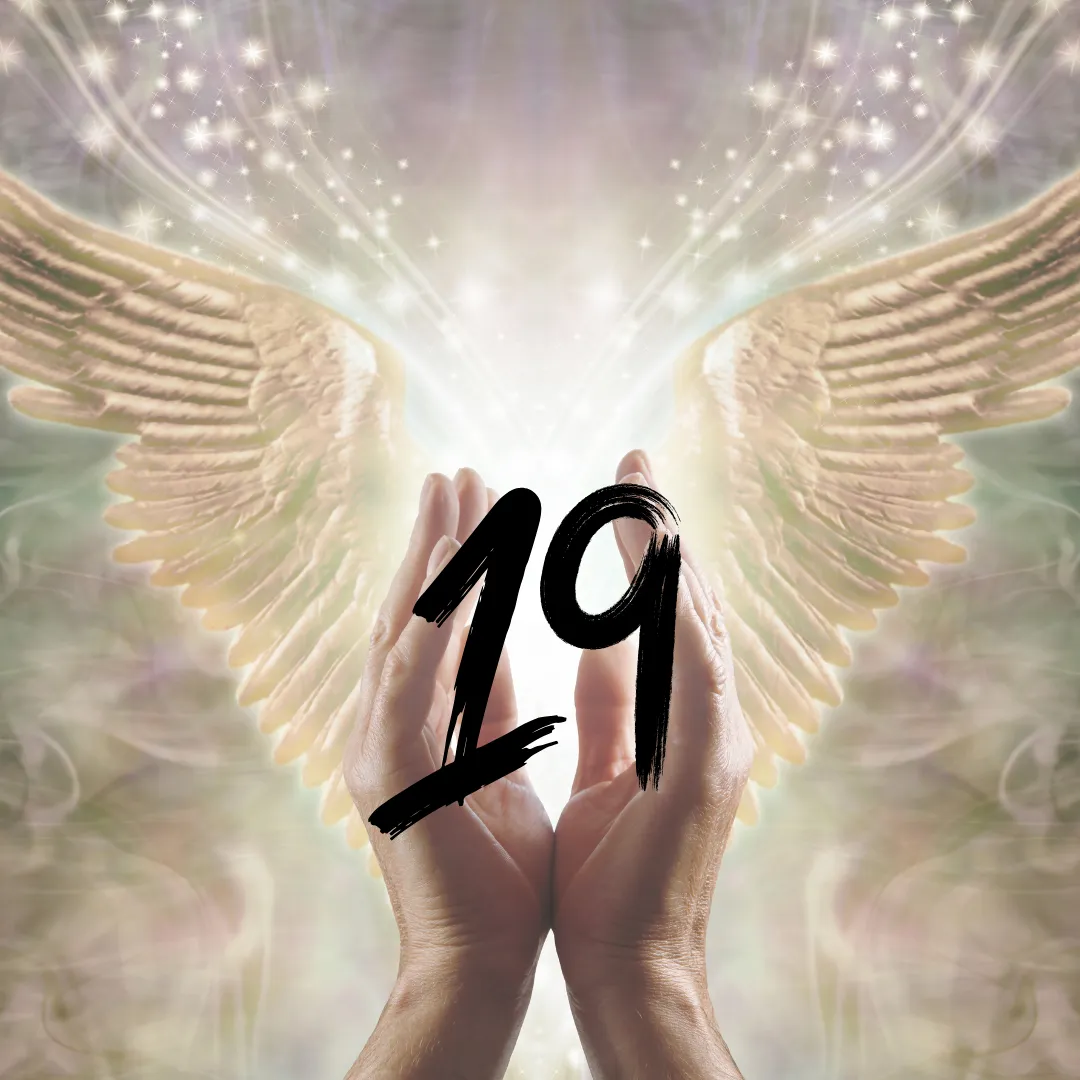 angel hands holding the number nineteen