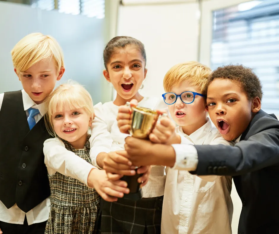 kids holding reading trophy