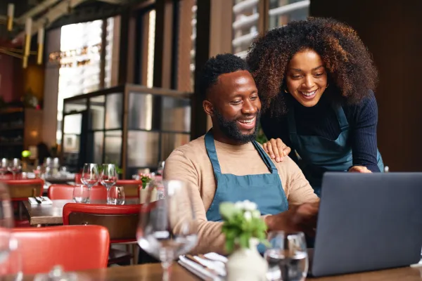 People looking at a laptop