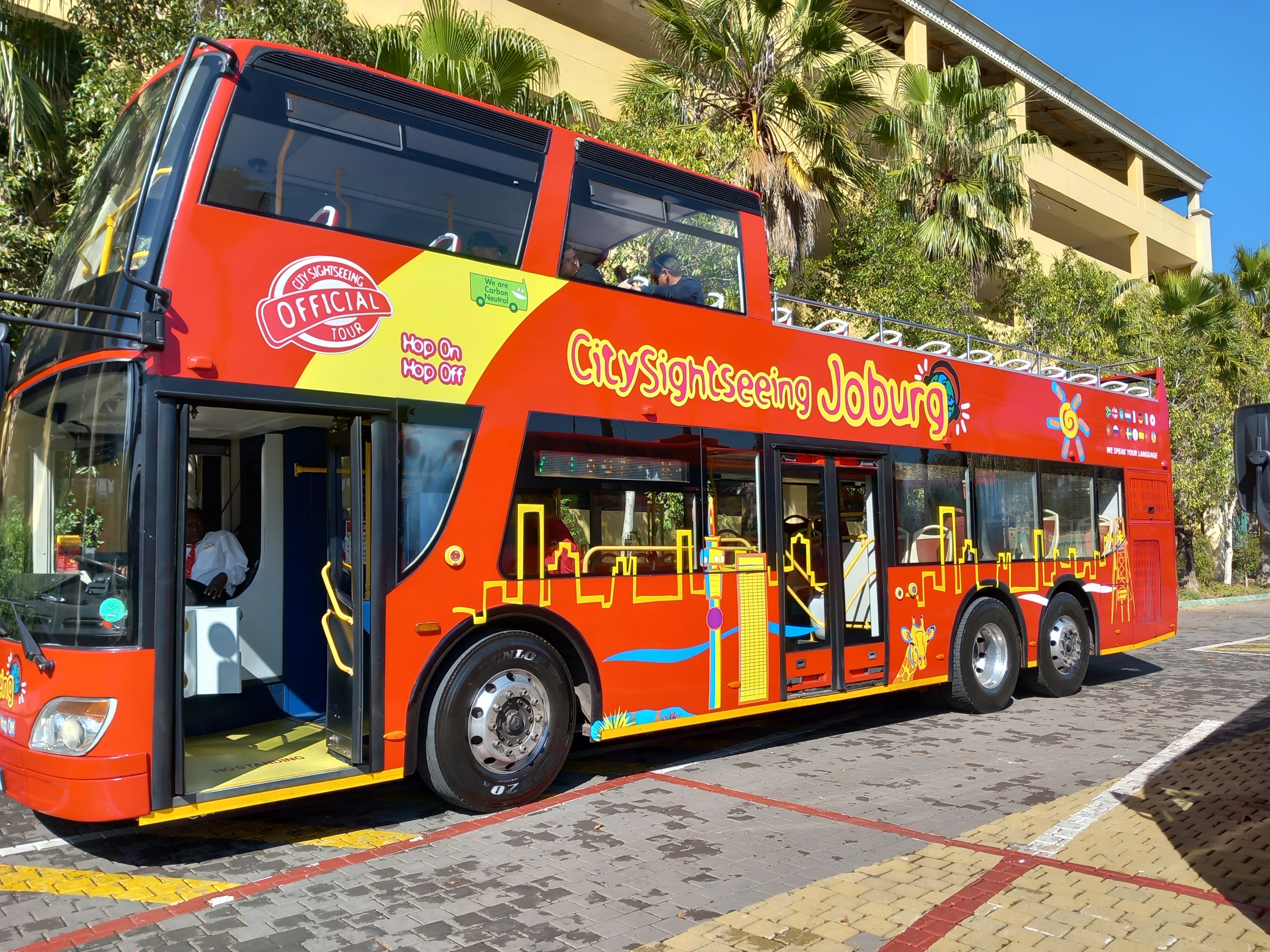 A red double-decker city sightseeing bus