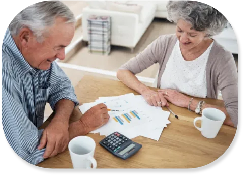 grey haired couple planning