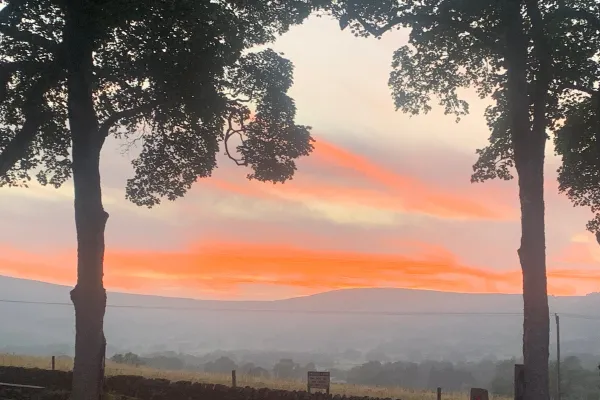 Quiet sunset over Mam Tor ridge marking the end of an expedition season