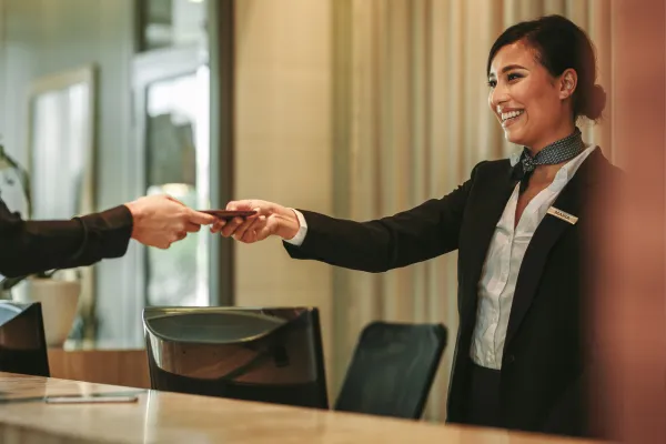 Worker checking in to hotel.