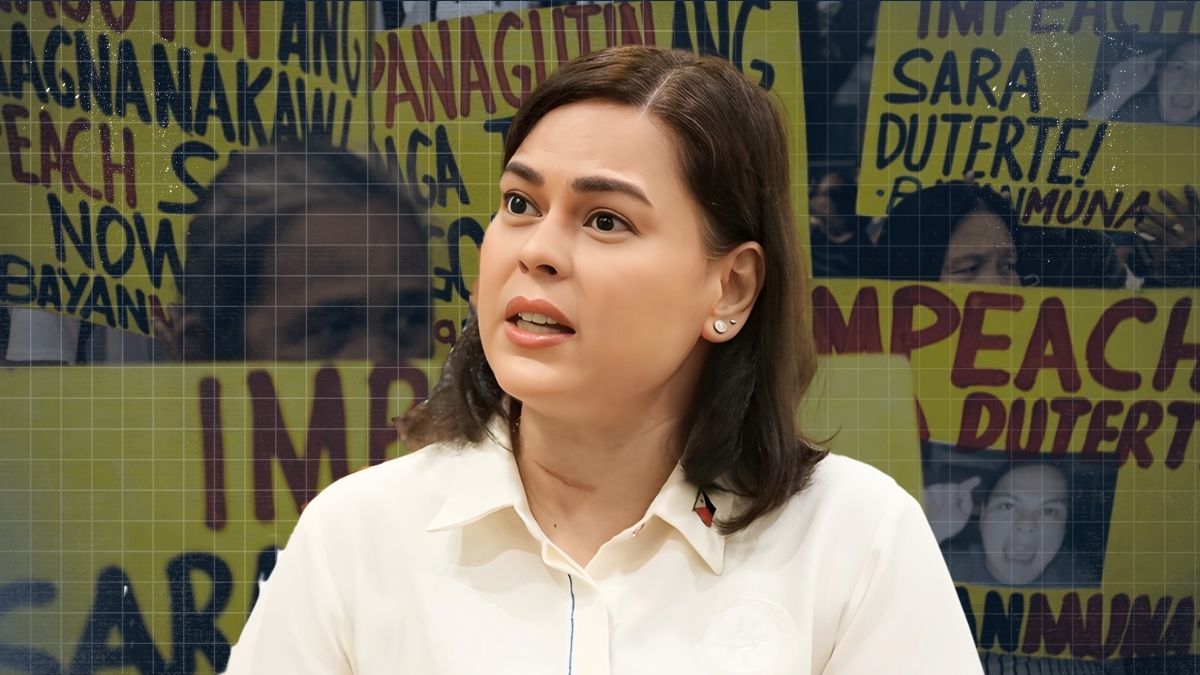 Vice President Sara Duterte smiling while speaking at a podium with the Philippine flag behind her during a press briefing.