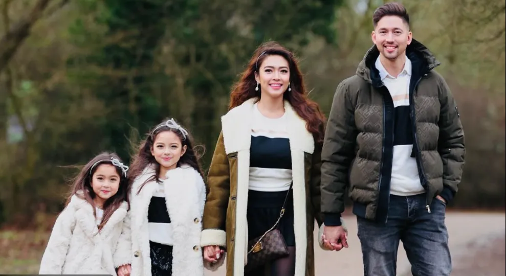 Bangs Garcia poses with her two daughters in the UK after sharing a road safety scare involving icy winter conditions.